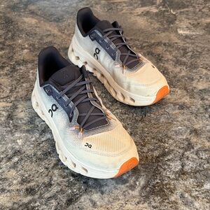 On Running Cream and Orange Athletic Shoes